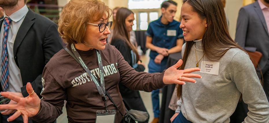 Student and alumna talking at a Bonnies 4 Bonnies event