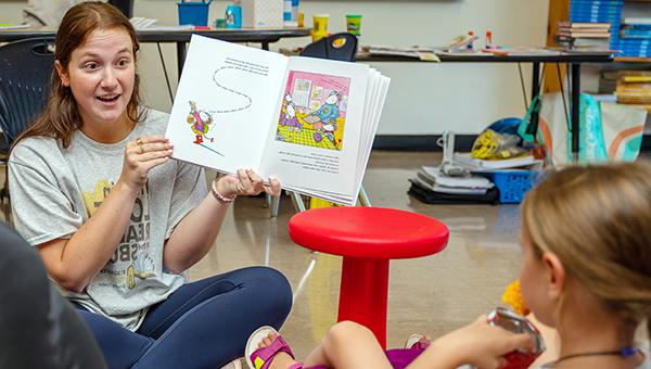 St. Bonaventure University literacy student reading to child